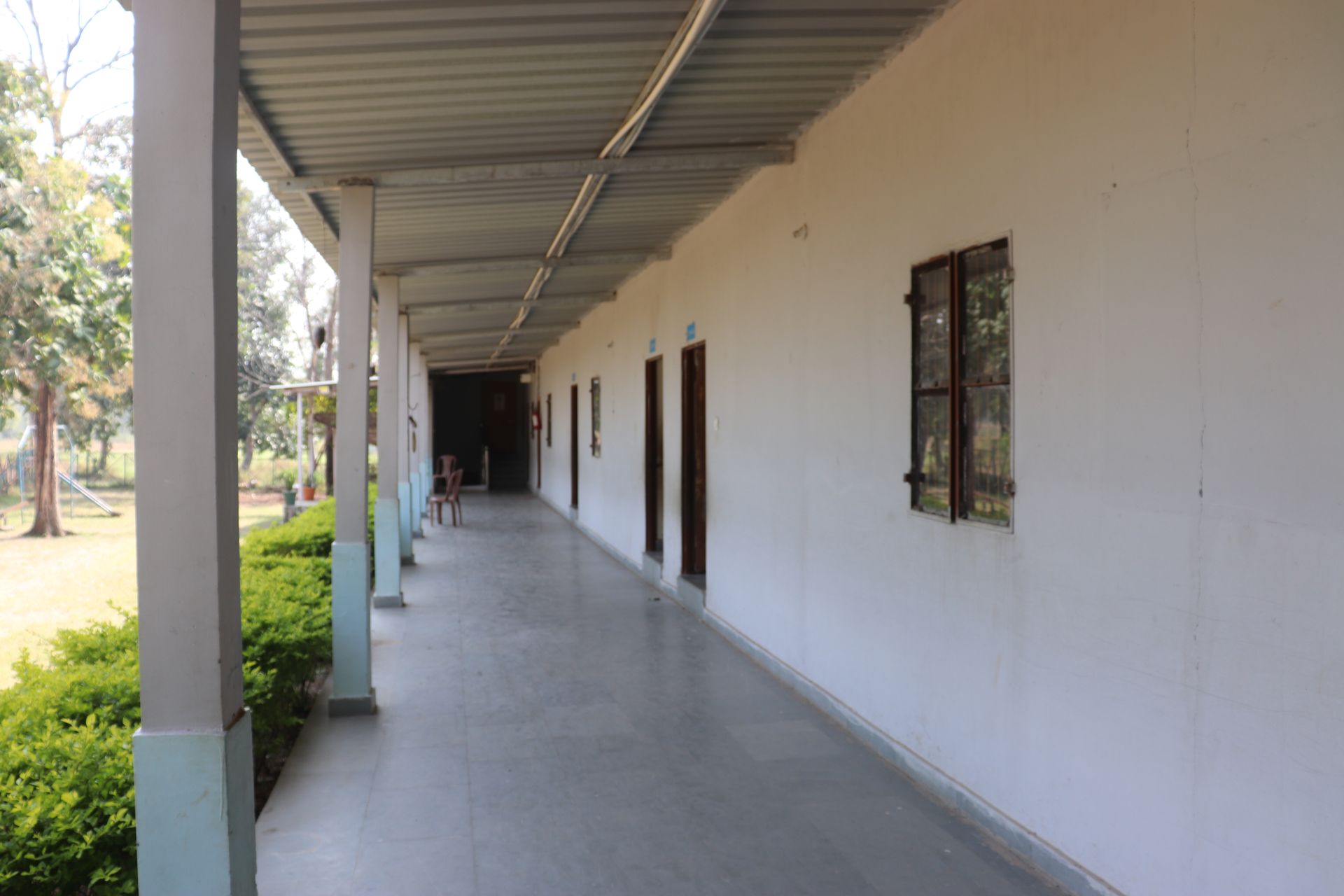 School corridor with green garden alongside