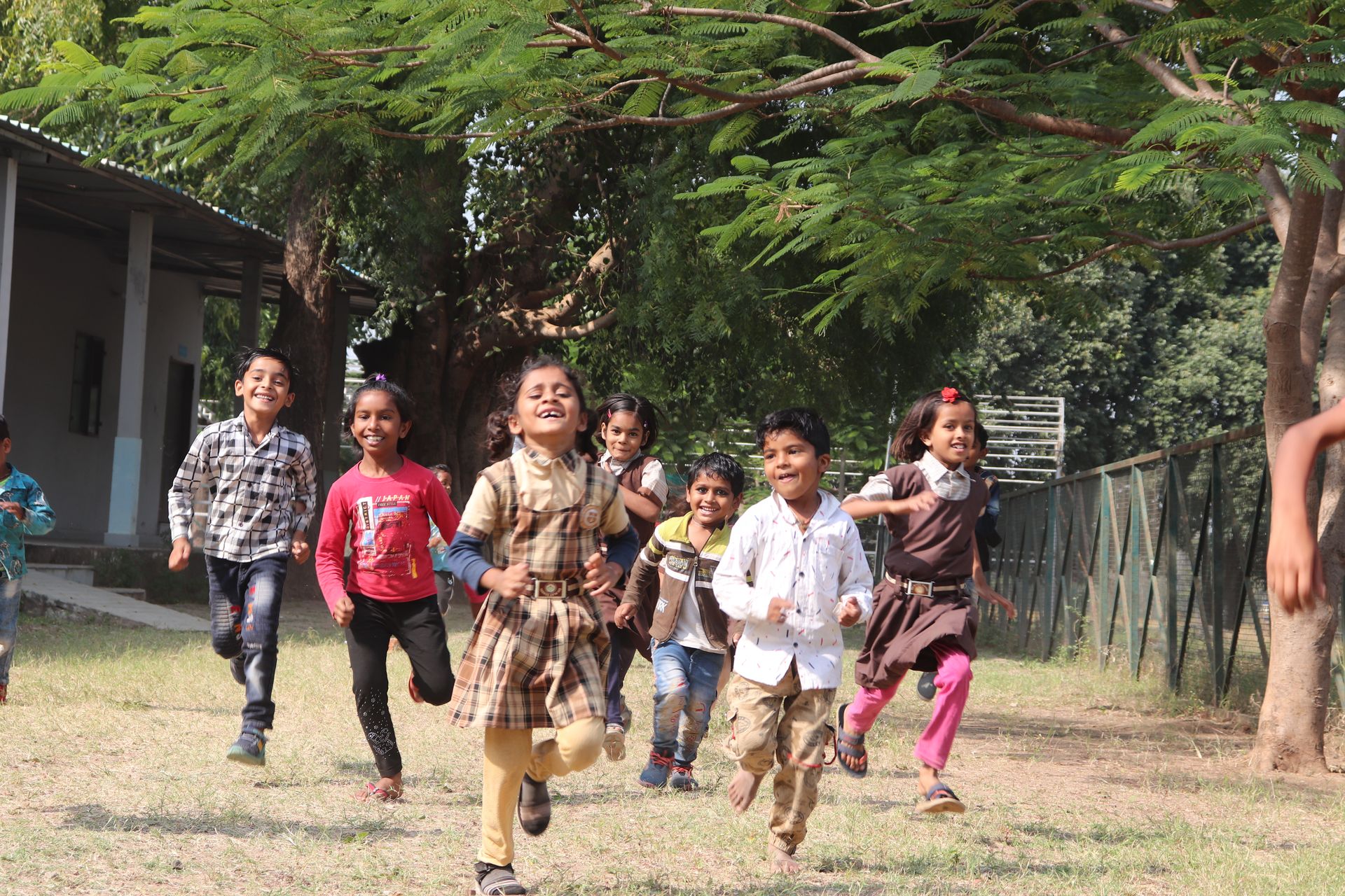 Children running and playing on the school ground